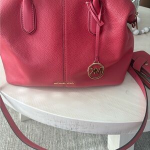 Michael Kors Pink Satchel with Gold Accents and matching wallet included.